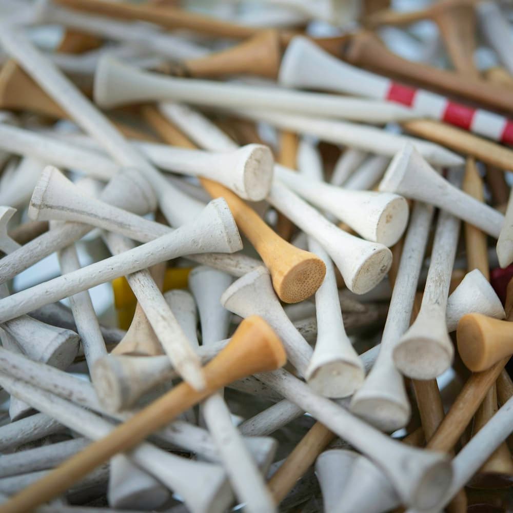 A bin of wooden tees